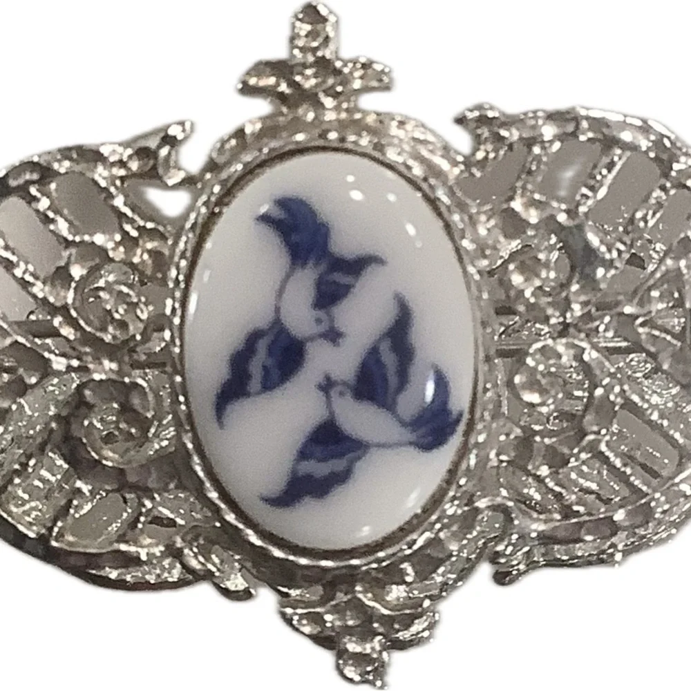 Silver-Tone Filigree Brooch with Blue/White Bird Design